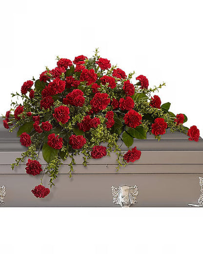 Red flowers on a gray casket