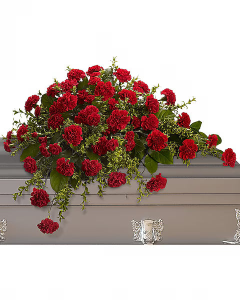 Red flowers on a gray casket