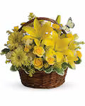 Wicker basket filled with yellow flowers